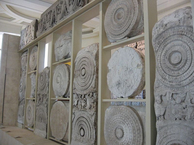 A display of stone carvings in a museum.