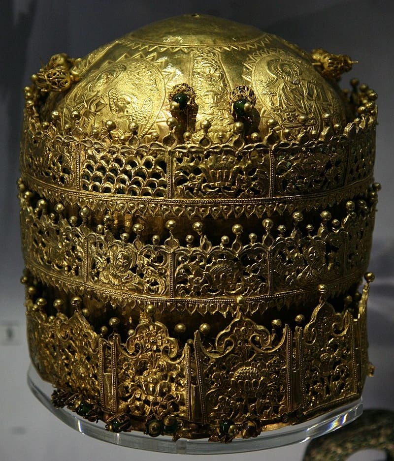 A gold crown on display in a museum.