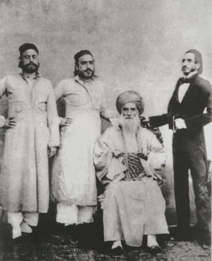 Four men posing for a photo.