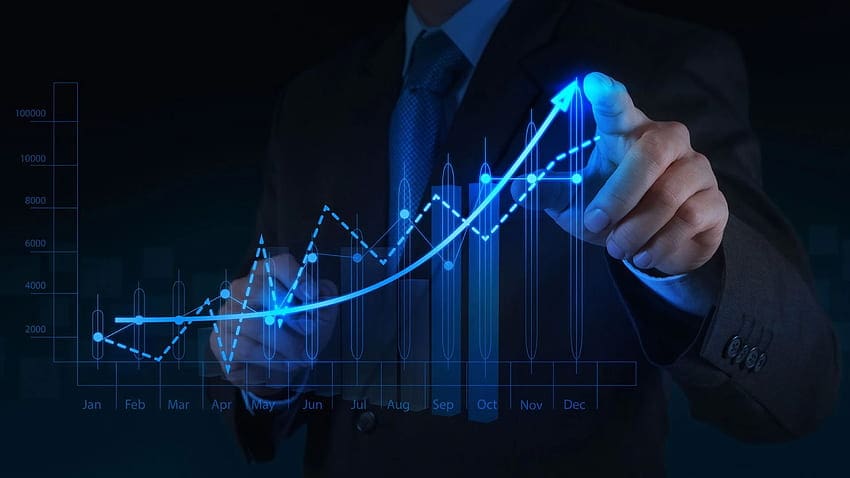 A businessman is pointing at a graph.